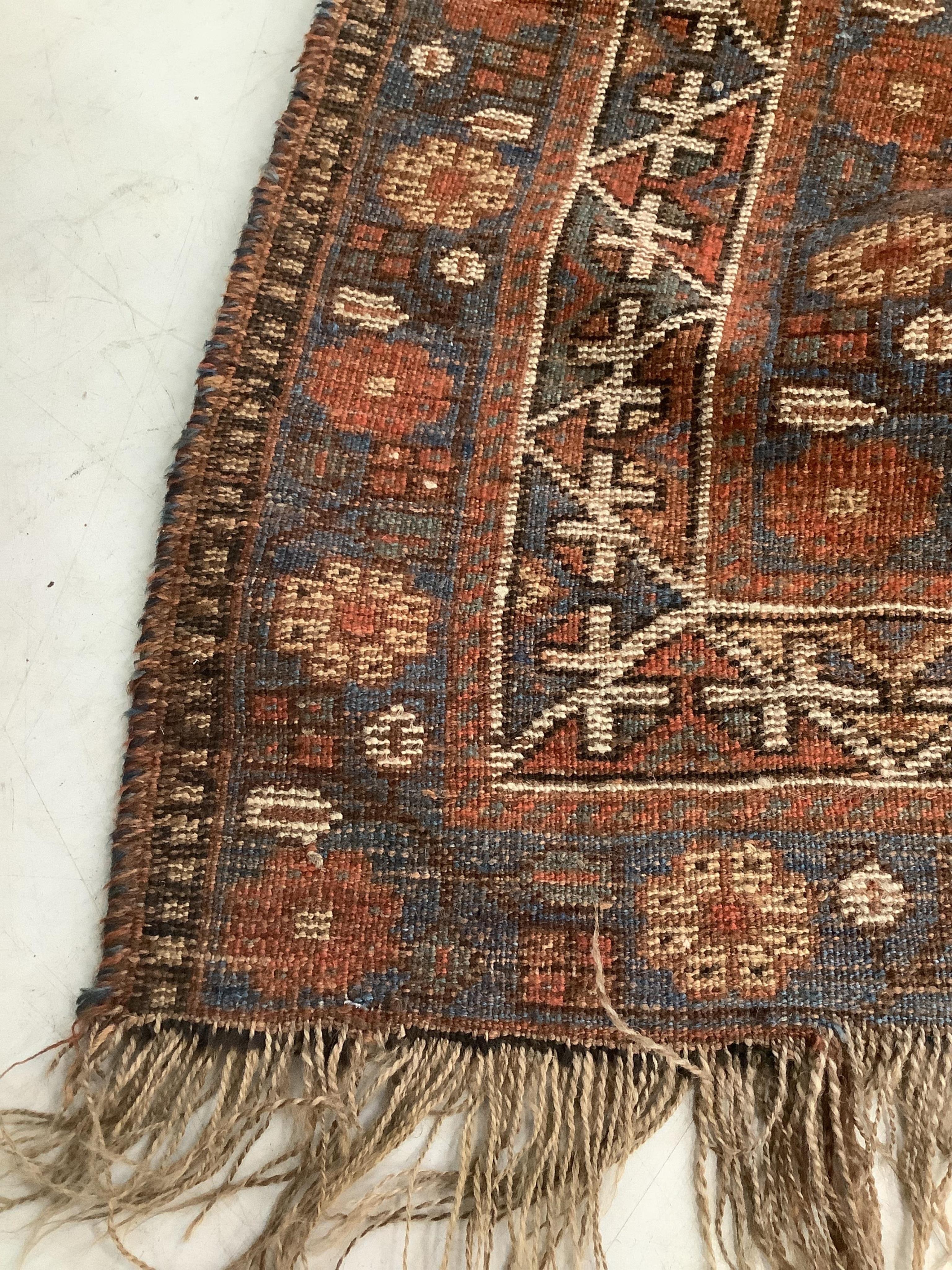 An antique Caucasian rug, Belouch mat and one other, largest 180 x 120cm. Condition - poor to good